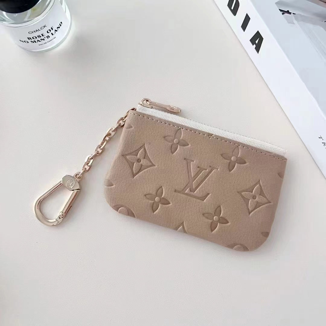 Coleção colorida de bolsas para moedas em relevo inspirada em LV com clipe de corrente