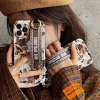 Capa para iPhone com pulseira de folha de bordo da moda