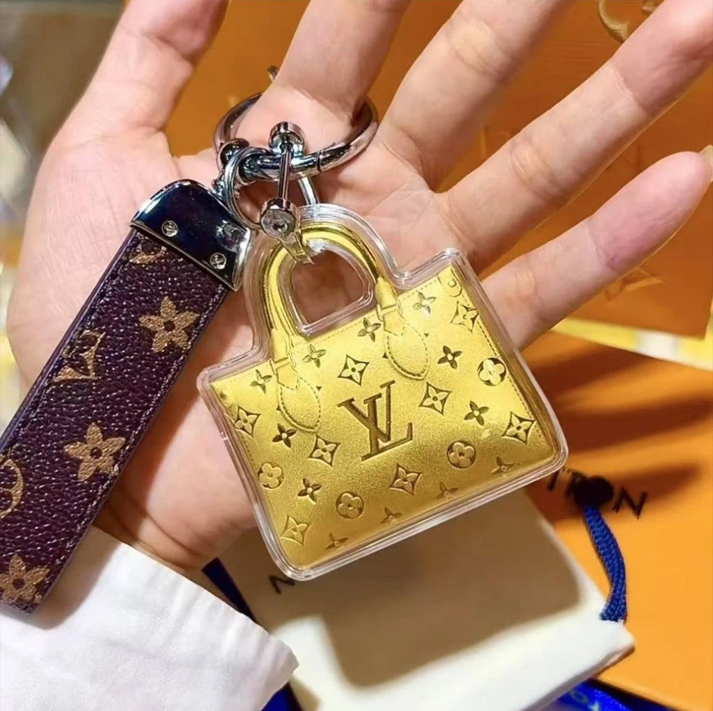 Mini borsa portachiavi dorata