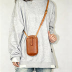 Handmade leather phone bag with shoulder strap