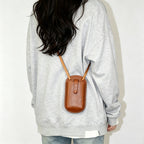 Handmade leather phone bag with shoulder strap