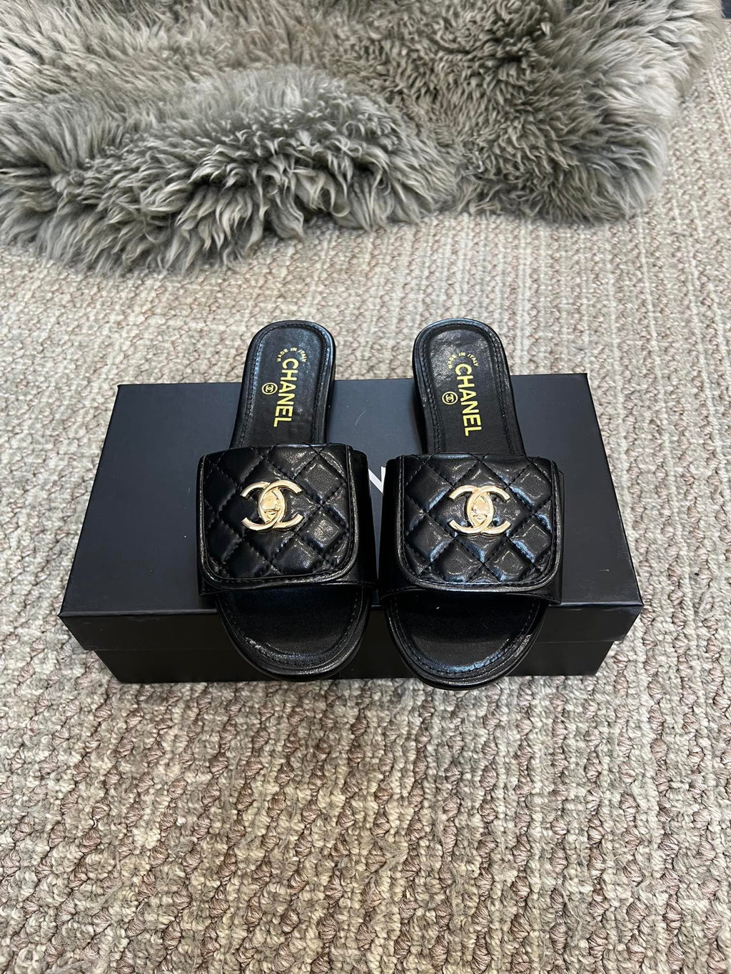 Luxury diamond-quilted flat slides with metal embellishments