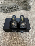 Luxury diamond-quilted flat slides with metal embellishments