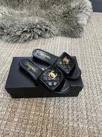 Luxury diamond-quilted flat slides with metal embellishments
