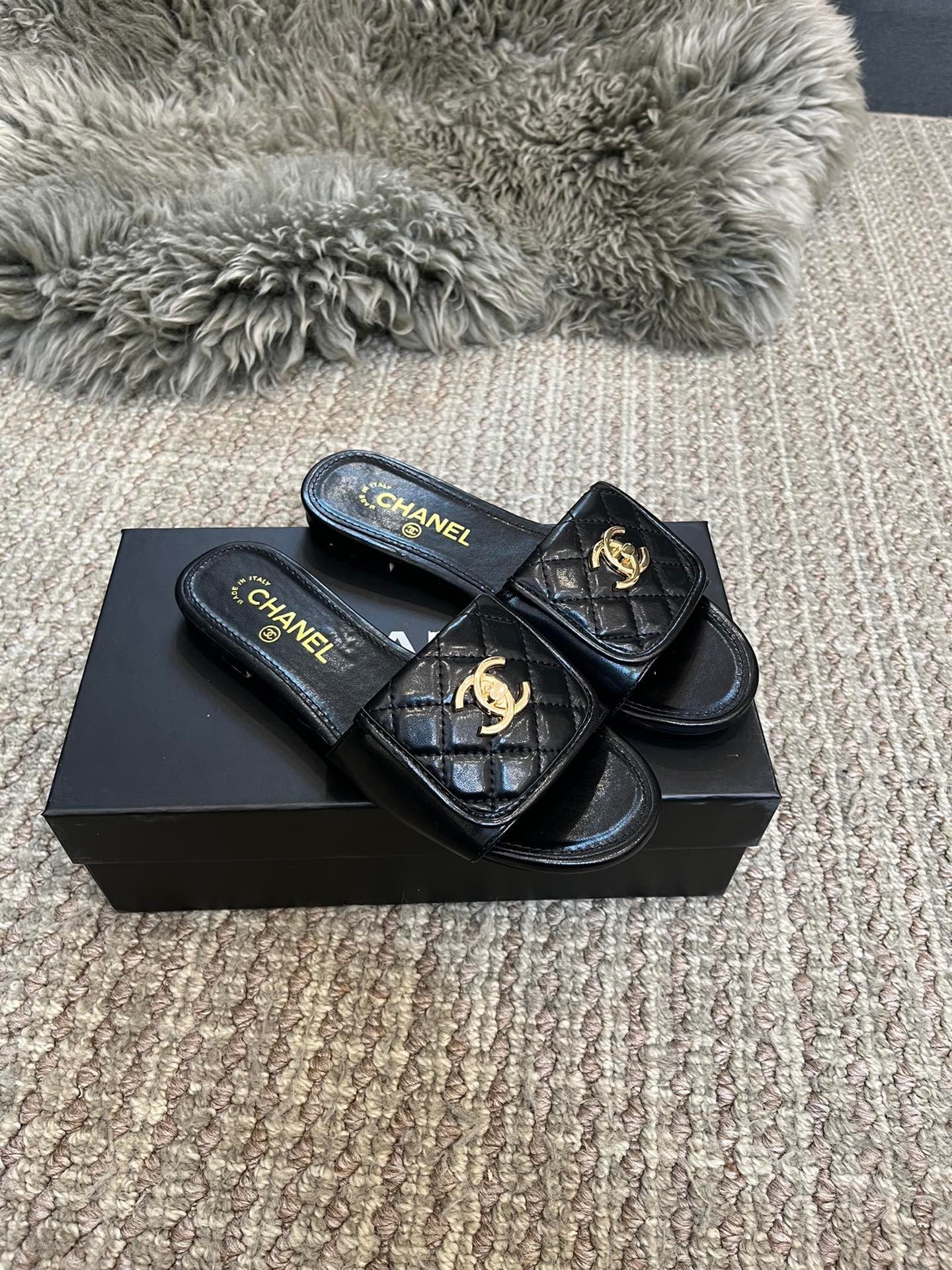 Luxury diamond-quilted flat slides with metal embellishments