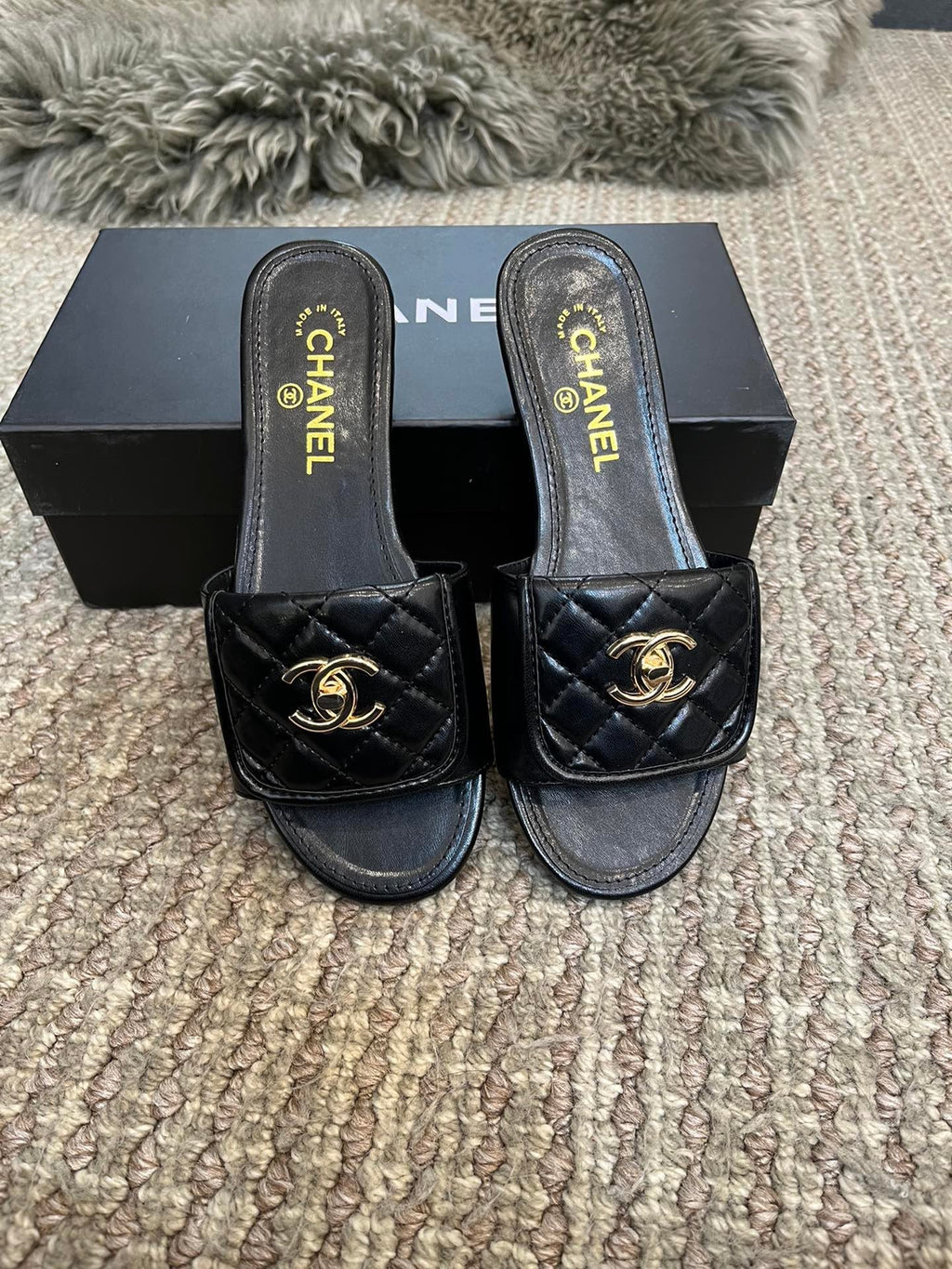 Luxury diamond-quilted flat slides with metal embellishments