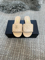 Luxury diamond-quilted flat slides with metal embellishments
