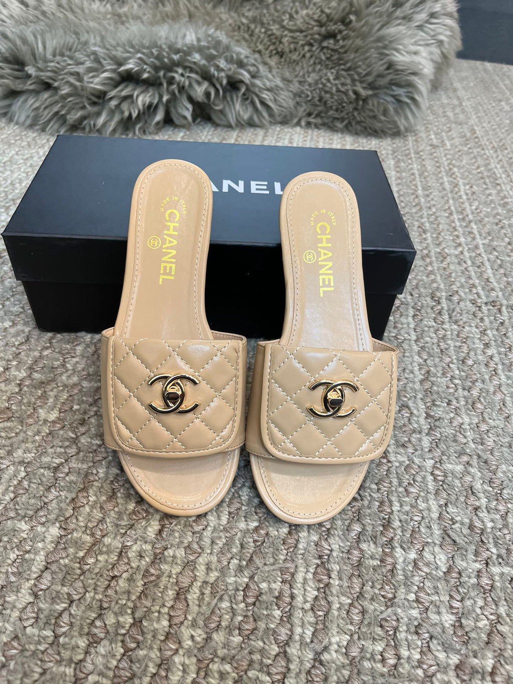 Luxury diamond-quilted flat slides with metal embellishments