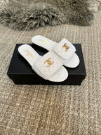 Luxury diamond-quilted flat slides with metal embellishments