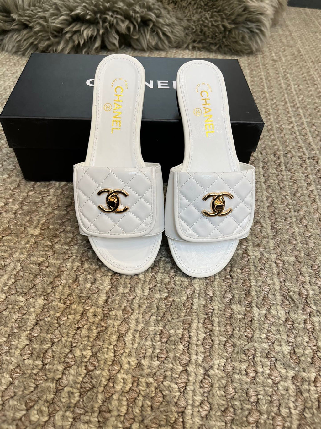 Luxury diamond-quilted flat slides with metal embellishments