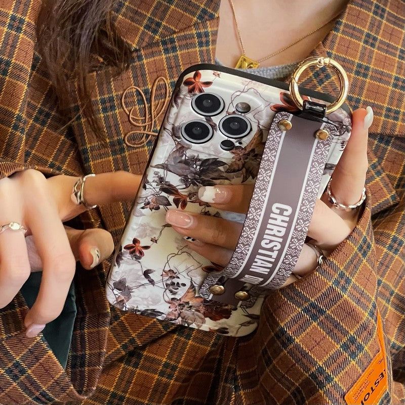 Capa para iPhone com pulseira de folha de bordo da moda