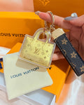 Mini borsa portachiavi dorata