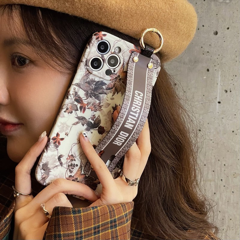 Capa para iPhone com pulseira de folha de bordo da moda